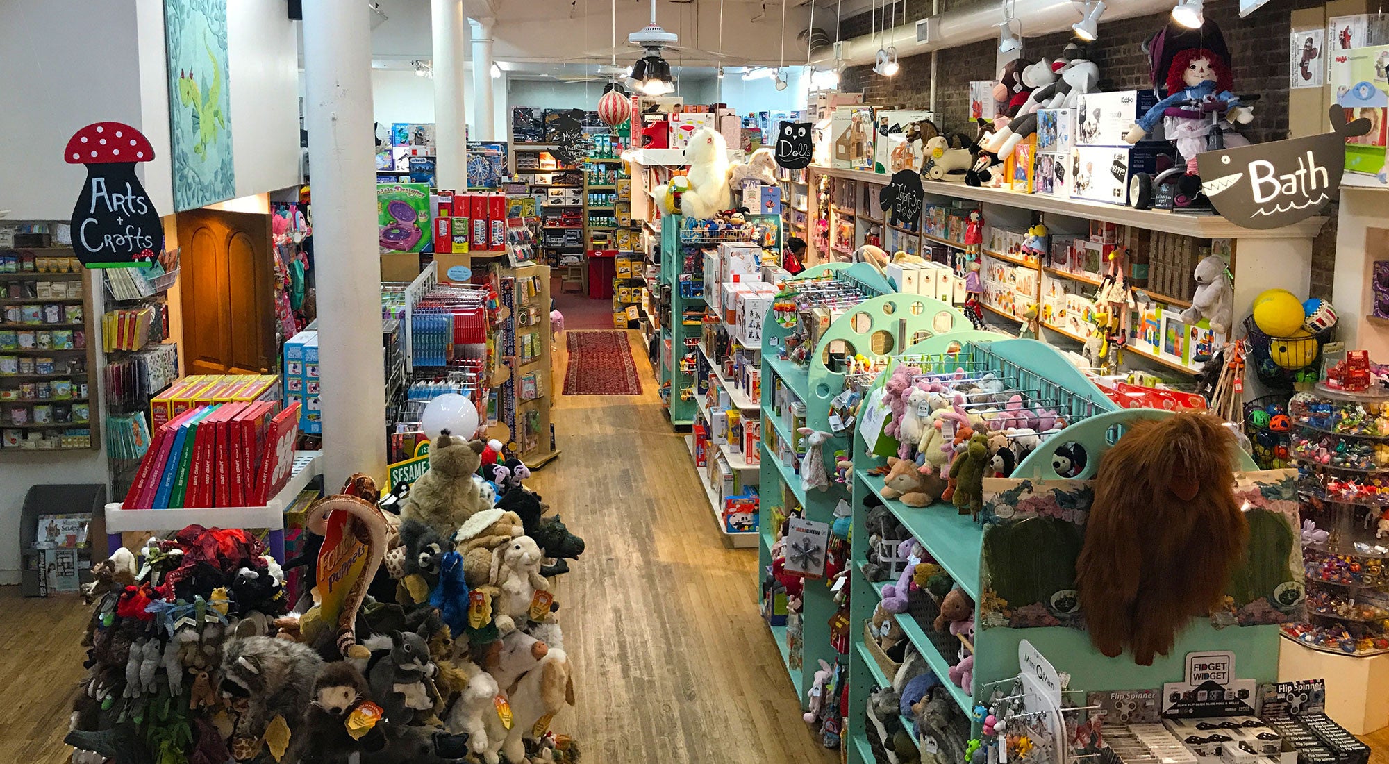 A toy store filled with an assortment of toys on shelves.